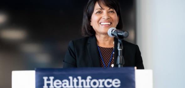 Photo of Healthforce Center Director Dr. Sunita Mutha at a podium.