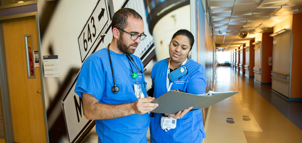 Nursing leaders examine a patient file