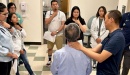 Photo of group of medical students learning in a clinical demonstration with a patient at UC Davis Health.