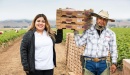 Photo of Nancy Oros Tinoco and Adolfo Gomez in a Salinas farm field.