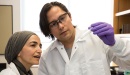 Medical lab technicians examine a health test