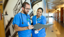 Nursing leaders examine a patient file