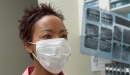 Photo of medically masked person in a medical setting